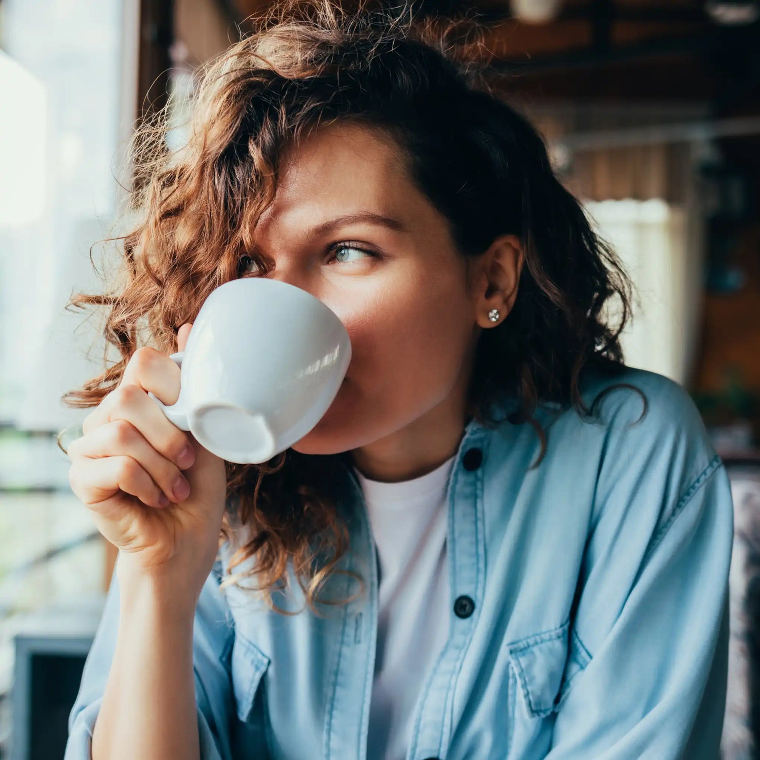 https://www.wilbyscoffeeco.com/cdn/shop/files/Lady-Drinking-Coffee.webp?v=1693763456&width=1500